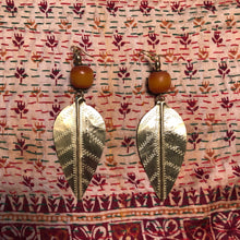Load image into Gallery viewer, Large brass Turkana earrings with African amber copal beads
