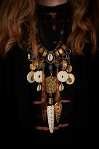 Necklace on leather string, blue glass beads